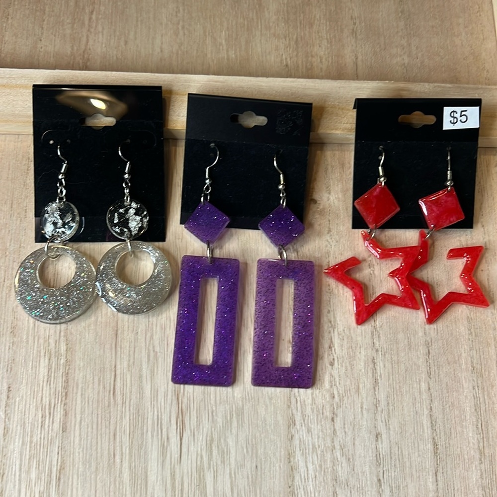 Three sets of dangle earrings
